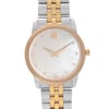 An image of a wristwatch taken from a front, close-up angle, highlighting the watch face. The watch has a gold-tone bezel and a mother-of-pearl dial with minimalist design. The hour markers are represented by small crystal embellishments. The watch features gold-toned hands and a two-tone metal bracelet in gold and silver. The crown is positioned on the right side. The watch is in pre-owned condition.
