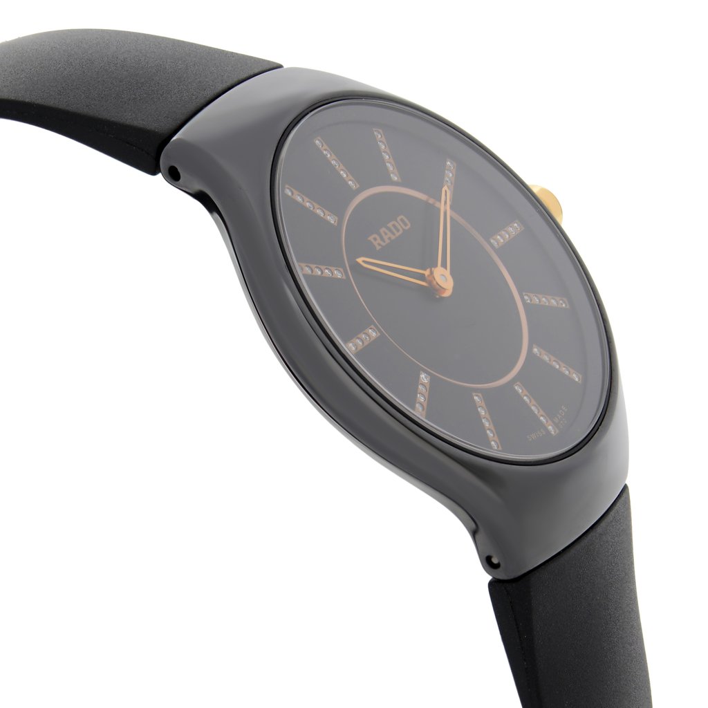 An image of a Wristwatch by Rado. This New With Defects item is designed for Women, featuring a Dress/Formal style. It has a Quartz movement and an Analog display with a Black dial color. The indices include 12-Hour Dial,Diamond Markers. The band is made of Rubber and the case is made of Ceramic. The watch has a Round shape with a case size of 30 mm and a case thickness of 5 mm.