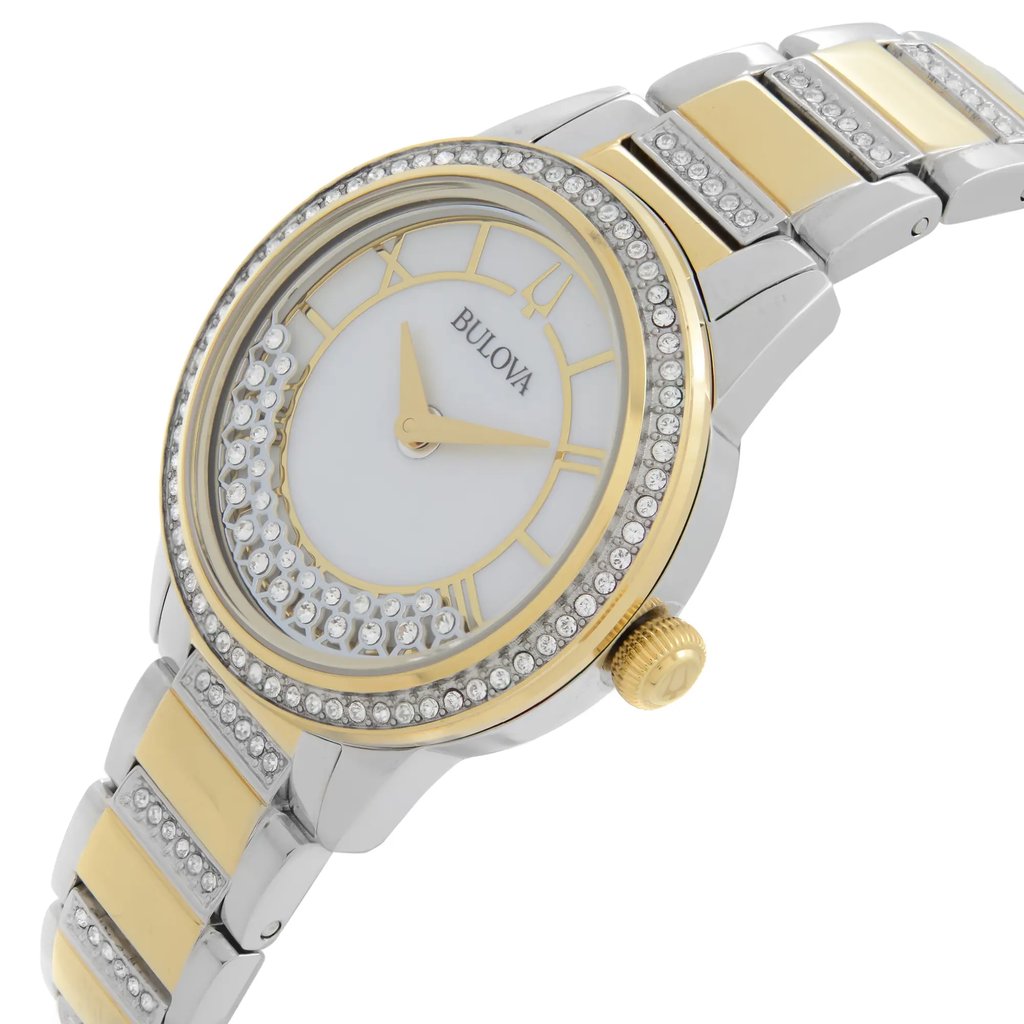 An image of a Bulova women's dress/formal wristwatch in a display model condition. The watch is presented in a side profile view highlighting the crown, which is at the right side of the watch face. It features a round white mother of pearl dial, encased in stainless steel with a gold-tone bezel adorned with clear diamonds. The gold-plated and stainless steel band transitions from the case with a mix of gold and silver-toned links. The watch hands appear in a gold color, complementing the brand logo and hour markers. The image is taken from a close, direct angle to showcase the details of the watch's side and dial.
