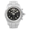 An image of a pre-owned Breitling men's wristwatch in good condition, featuring a front full frontal view. The luxury watch has a round shape with a black dial, steel bezel, and stainless steel band and case. The dial includes 12-hour indices with Arabic numerals, sub-dials, and square indexes. The watch is viewed head-on and occupies the majority of the frame, with a clear focus on its details. The watch is pre-owned and may show signs of wear and scratches.
