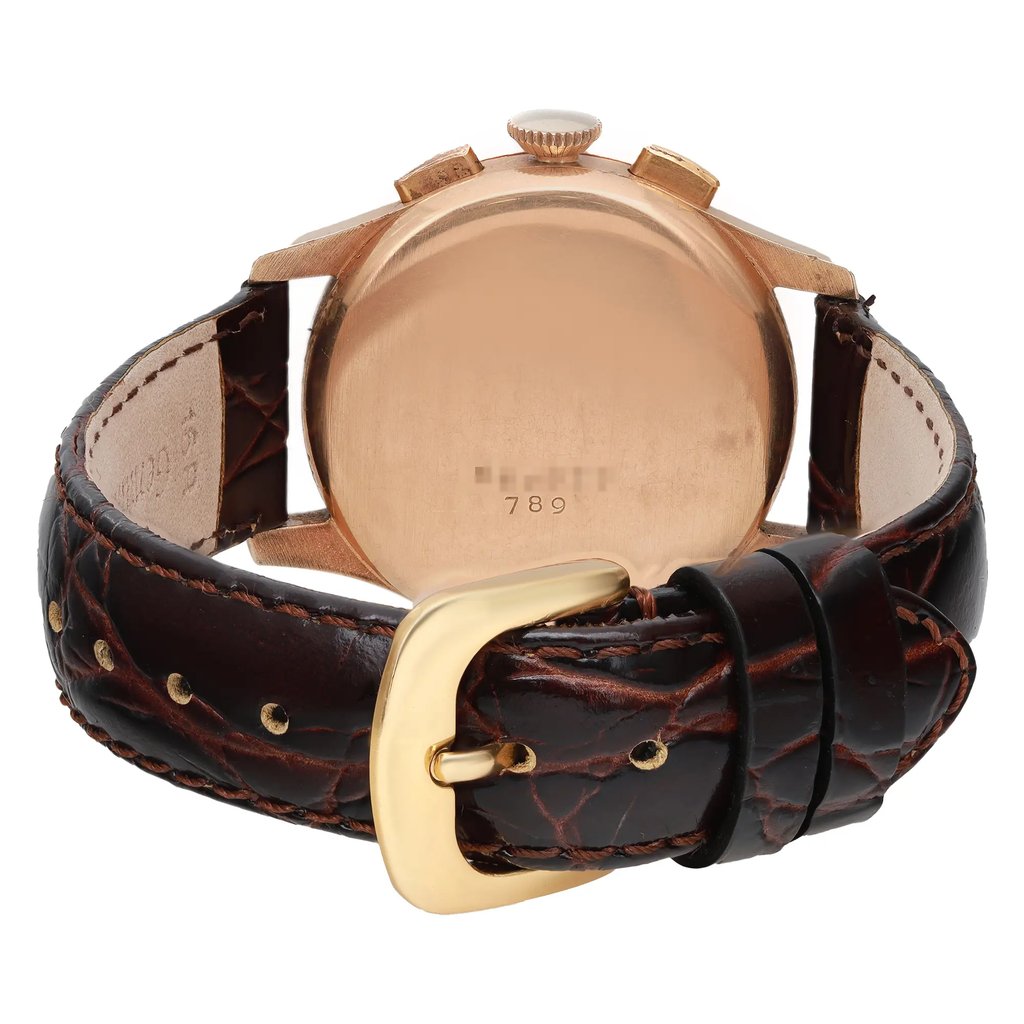 An image of a pre-owned Breitling wristwatch for men, captured from the back view showing a closed clasp. The rose gold caseback is a snap type and is in focus at a close distance, positioned centrally in the frame. Attached is an aftermarket leather band in dark brown with visible stitching and a gold-tone buckle closure, looped and fastened, occupying the foreground.