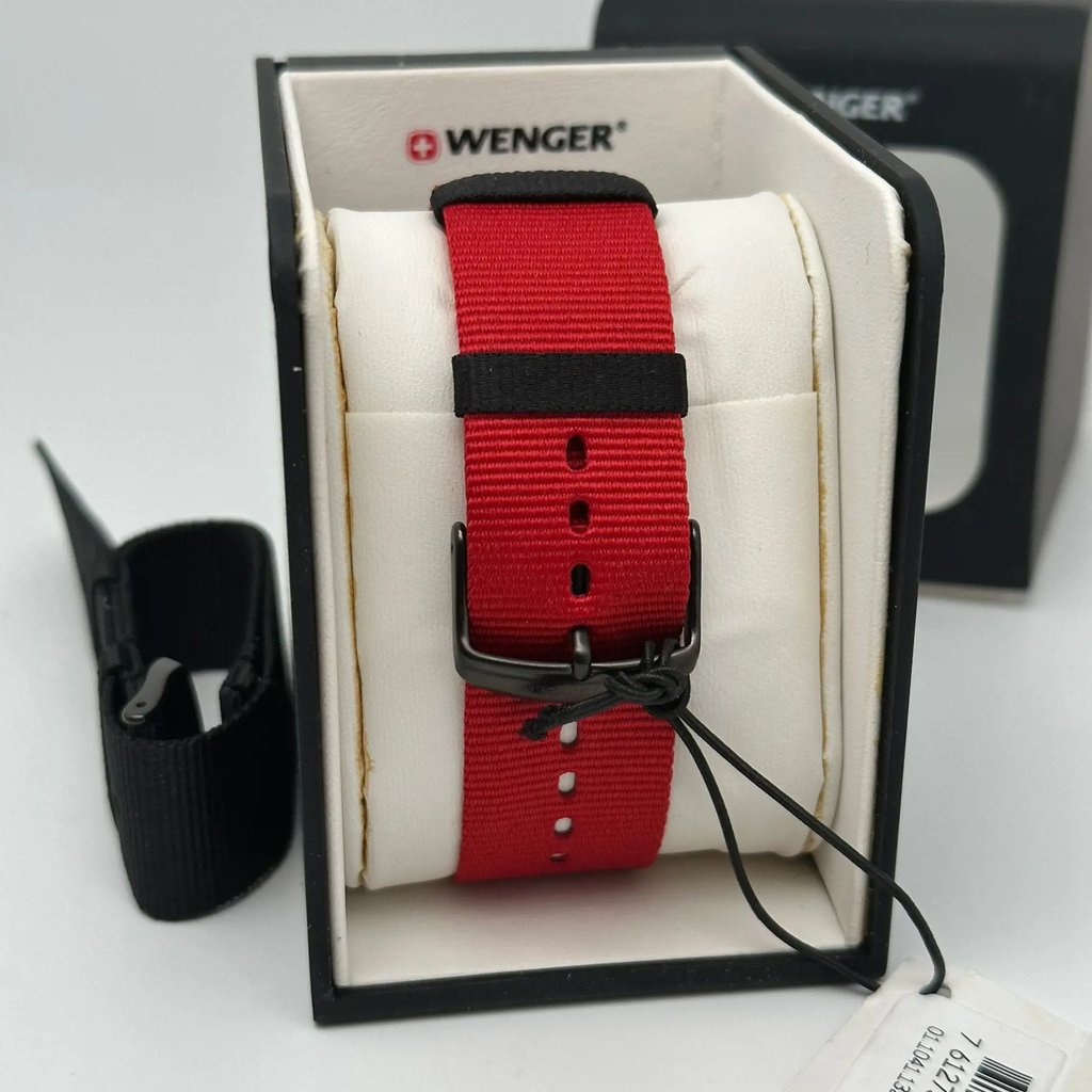 An image of a Wristwatch by Wenger. This Display Model item is designed for Men, featuring a Casual style. It has a Quartz movement and an Analog display with a Black dial color. The indices include 12-Hour Dial,Arabic Numerals,Stick Indexes. The band is made of Nylon and the case is made of Stainless Steel. The watch has a Round shape with a case size of 41 mm and a case thickness of 10 mm.
