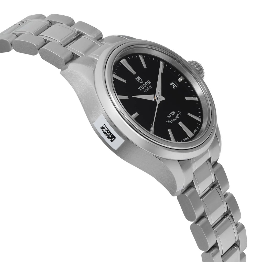 An image of a wristwatch taken from a side profile view, opposite the crown. The watch is unworn and features a metallic bracelet and a sleek black dial. The angle highlights the thickness of the watch case and the polished links of the bracelet. The photograph is taken at a moderate distance, capturing the elegance and detail of the timepiece.