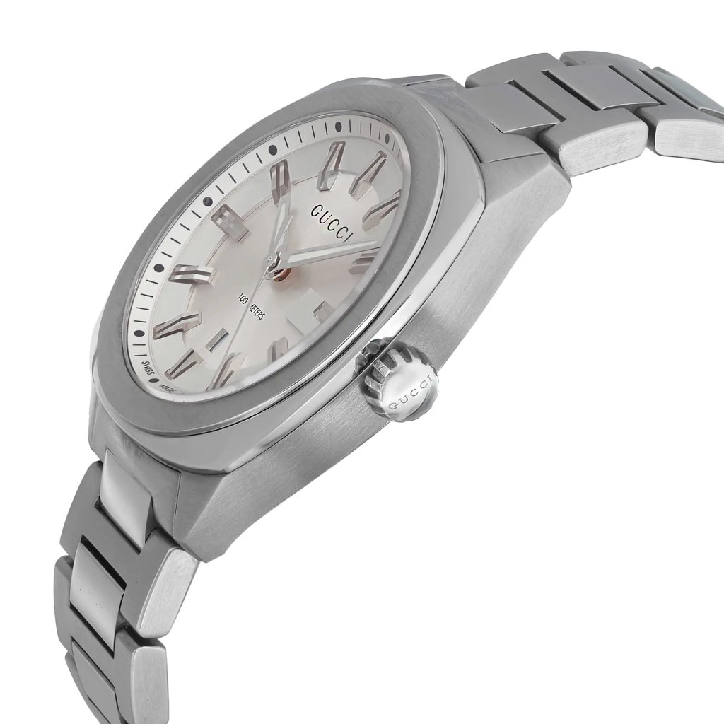 An image of a Wristwatch by Gucci. This Pre Owned item is designed for Unisex Adult, featuring a Casual style. It has a Quartz movement and an Analog display with a Silver dial color. The indices include 12-Hour Dial,Stick Indexes. The band is made of Stainless Steel and the case is made of Stainless Steel. The watch has a Round shape with a case size of 37 mm and a case thickness of 9.5 mm.