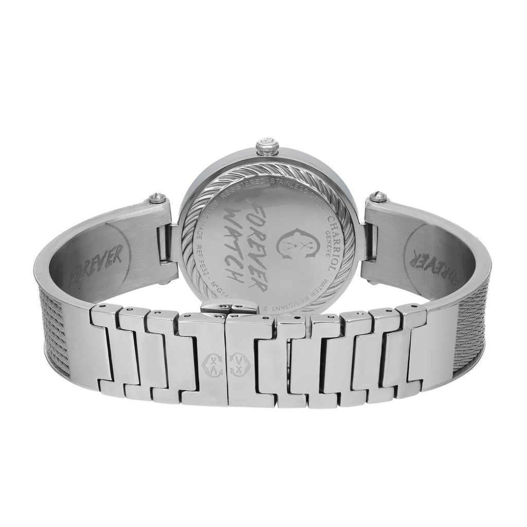 An image of a pre-owned wristwatch showing the back view, with the clasp closed. The angle is slightly elevated, capturing the full rear side of the watch, including the detailed engraving on the case back. The watch is centered in the frame, positioned at a close distance, highlighting the stainless steel bracelet and intricate design features.