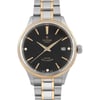 An image of a wristwatch taken from a front close-up angle, showcasing the watch face. The watch is unworn, featuring a black dial with gold hour markers and hands. The bracelet is a combination of silver and gold tones. The date is visible on the right side of the watch face.