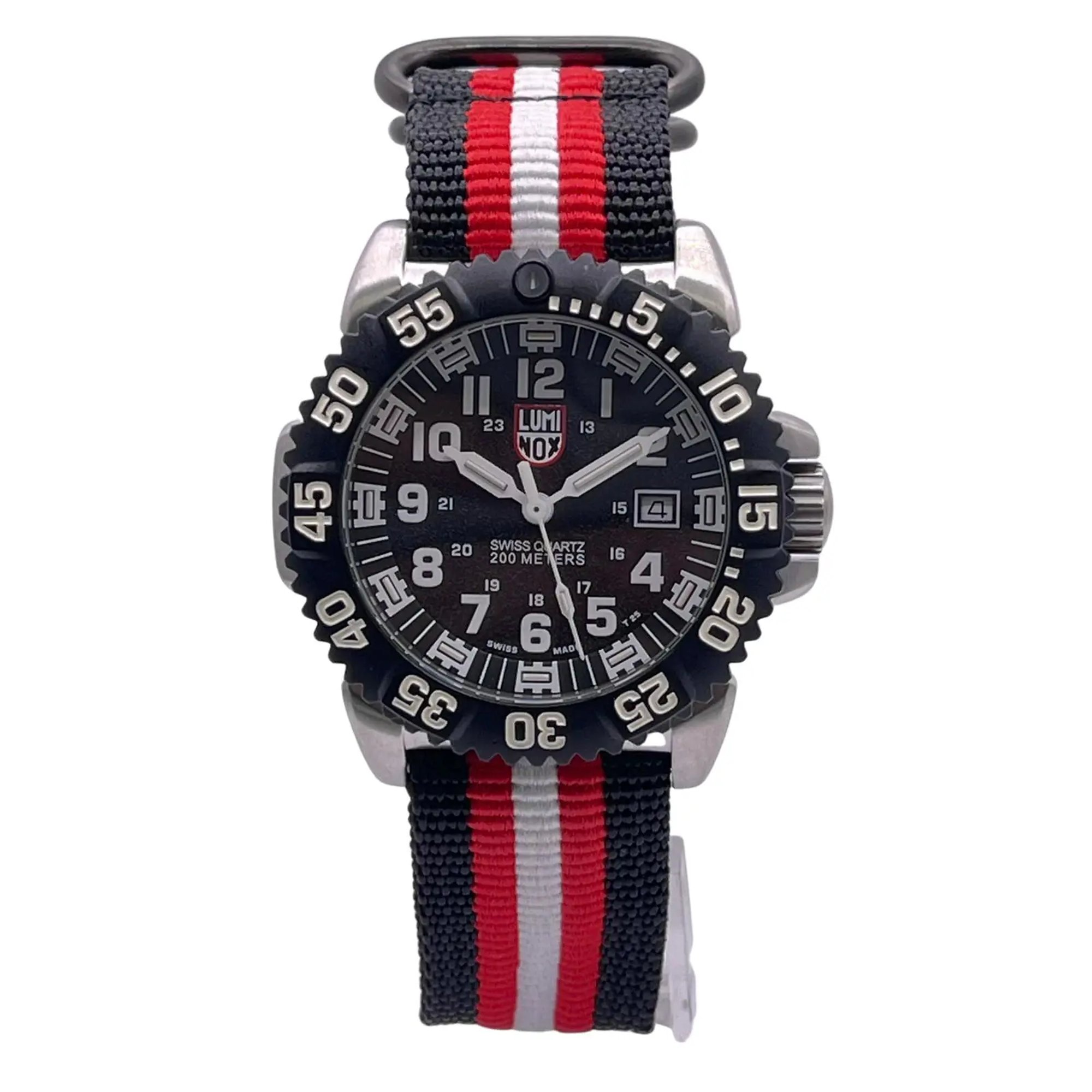 An image of a Wristwatch by Luminox. This Pre Owned item is designed for Men, featuring a Casual,Diver style. It has a Quartz movement and an Analog display with a Black dial color. The indices include 12-Hour Dial,Arabic Numerals,Easy to Read/Large Numerals. The band is made of Nylon and the case is made of Stainless Steel. The watch has a Round shape with a case size of 45 mm and a case thickness of 13 mm.