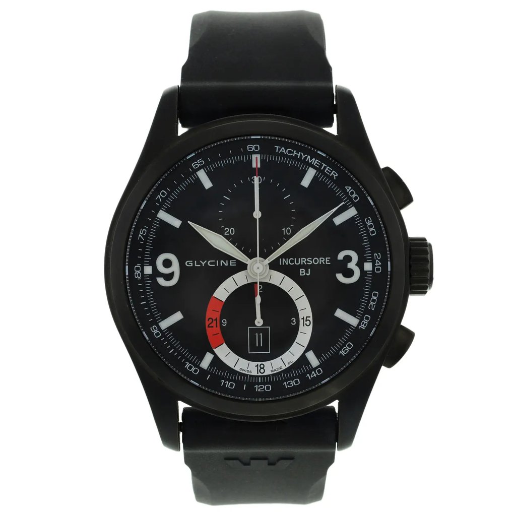 An image of a Wristwatch by Glycine. This Display Model item is designed for Men, featuring a Sport style. It has a Mechanical (Manual) movement and an Analog display with a Black dial color. The indices include Multi Dial,Sticks & Numerals. The band is made of Silicon/Rubber and the case is made of Stainless Steel. The watch has a Round shape with a case size of 46 mm and a case thickness of 14 mm.