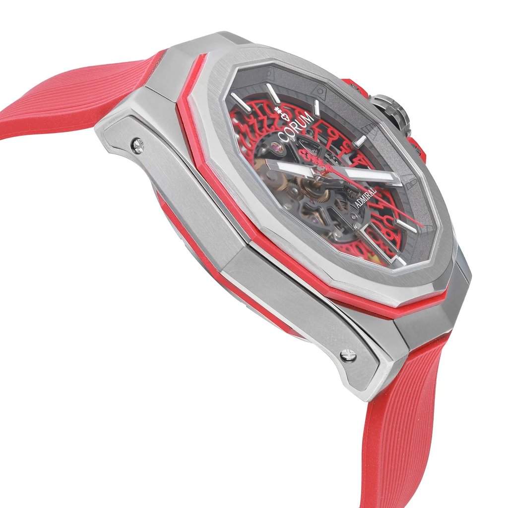 An image of a Wristwatch by Corum. This Display Model item is designed for Men, featuring a Luxury style. It has a Mechanical (Automatic) movement and an Analog display with a Gray dial color. The indices include 12-Hour Dial,Stick Indexes. The band is made of Rubber and the case is made of Titanium. The watch has a DODECAGONAL shape with a case size of 45 mm and a case thickness of 14 mm.