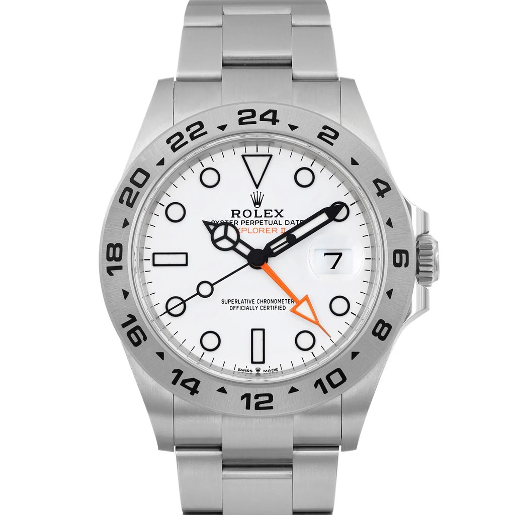 An image of a pre-owned wristwatch, shown in a front close-up shot focusing on the watch face. The watch has a white dial with black hour markers and hands, and an orange 24-hour hand. The bezel is marked with 24-hour numerals. The watch is positioned vertically, capturing the face and a portion of the metal bracelet.