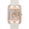 An image of a pre-owned women's HERMÈS Cod Joaillier wristwatch. The watch is positioned upright, showcasing a rectangular face adorned with intricate, diamond-studded designs. It features a 18k rose gold case with additional diamond embellishments along the edges. The watch is photographed from a front angle at a close distance, emphasizing its luxurious details and craftsmanship. The strap is light-colored, contrasting elegantly with the watch face.
