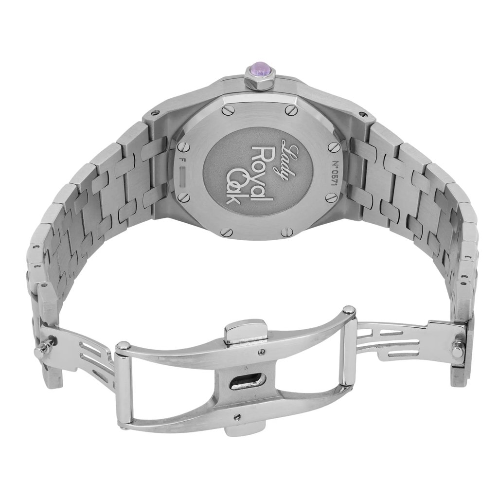 An image of a pre-owned Audemars Piguet women's wristwatch, showcasing the back view from a close perspective. The watch is positioned with its clasp open, revealing the engraved "Lady Royal Oak" on the case back. The angle highlights the stainless steel bracelet and the detailing of the links and clasp mechanism. The watch is centrally positioned in the frame.