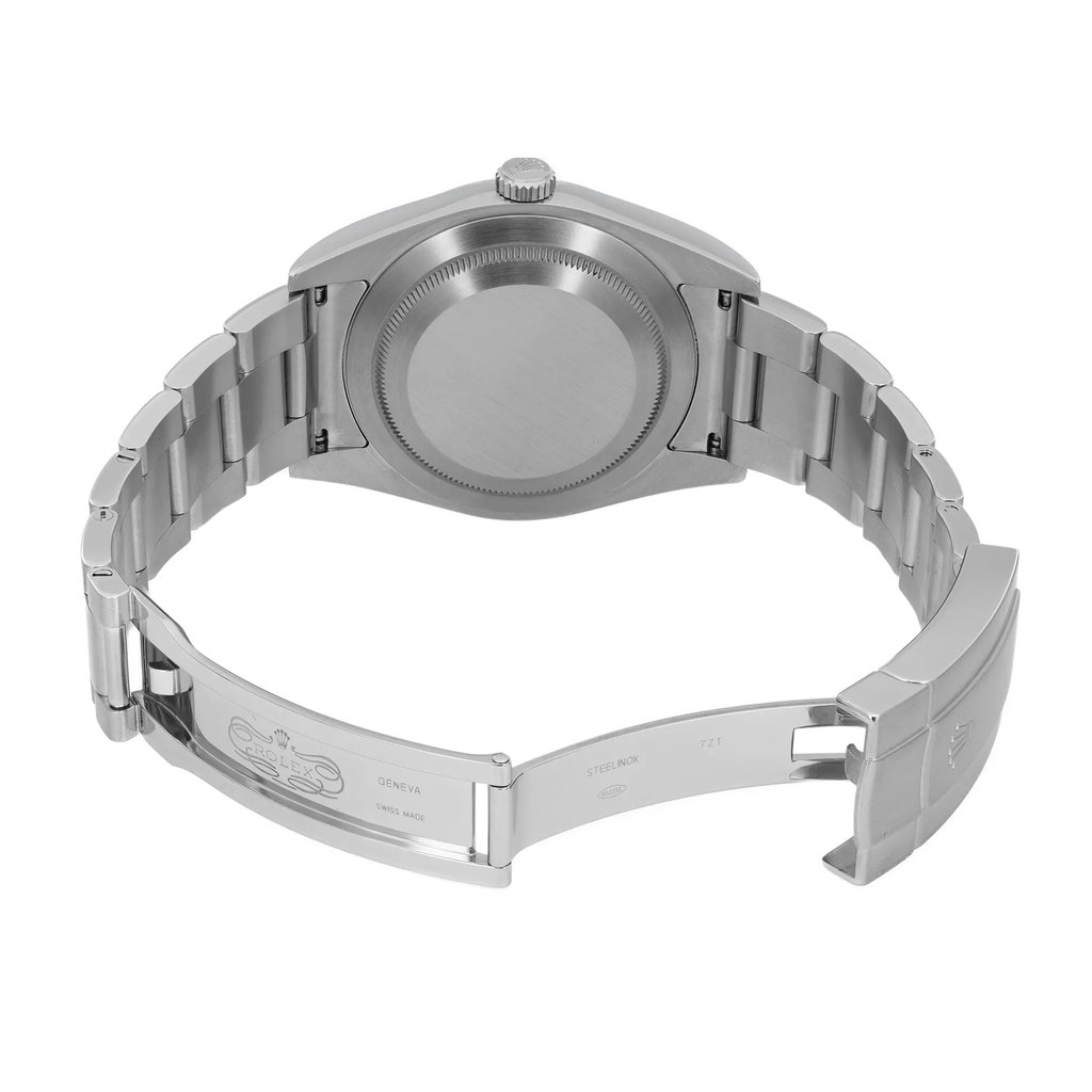 An image of a pre-owned men's Rolex wristwatch, viewed from the back at a slight angle, with the open clasp prominently displayed. The watch features a stainless steel case and band, with a round screwback caseback. The fold-over clasp is visible, showcasing the Rolex branding and inscriptions on the inner clasp. The watch is in good condition, and the photo is taken from a close distance.