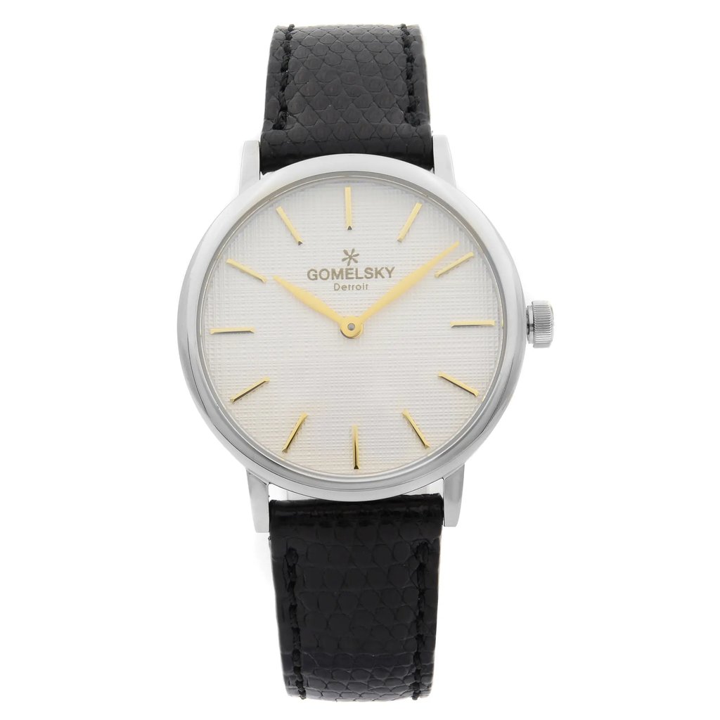 An image of a wristwatch shown from a front full frontal view. The watch features a clean, unworn design with a white textured dial and gold hour markers. It has a black leather strap and a silver case, with the brand name visible on the dial. The angle is straight-on, capturing the watch head-on at a medium distance.