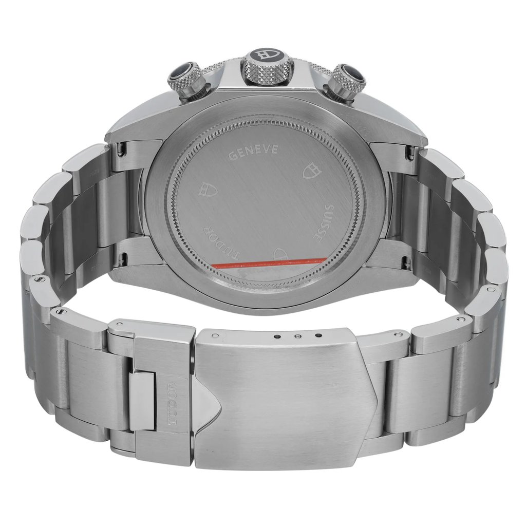 An image of a wristwatch showcasing the back view with a focus on the closed clasp. The watch features a stainless steel bracelet and a round case back. The angle is slightly elevated, providing a clear view of the clasp and the engraved details on the case back. The condition of the watch is a display model, evident from its pristine appearance. The image is taken from a close distance to highlight the craftsmanship and material quality.
