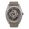 An image of a pre-owned Vacheron Constantin Quai de l'Ile Titanium men's wristwatch, viewed from the front at a close distance. The watch has a detailed dial featuring luminous hands, multiple sub-dials, and visible mechanical components. The case is metallic with a textured, light brown leather strap. Comes with a Vacheron Passport. Unworn Band. No original box. Recently serviced. The movement is calibrated and keeps time well.

