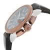 An image of a new Gucci wristwatch for men with defects, shown from a close-up side angle highlighting its rose gold case and crown, grey dial with Gucci logo, chronograph features, luminous hands, and a small seconds subdial. The watch is attached to a dark grey leather strap, partly visible, pointing towards the bottom right of the frame.