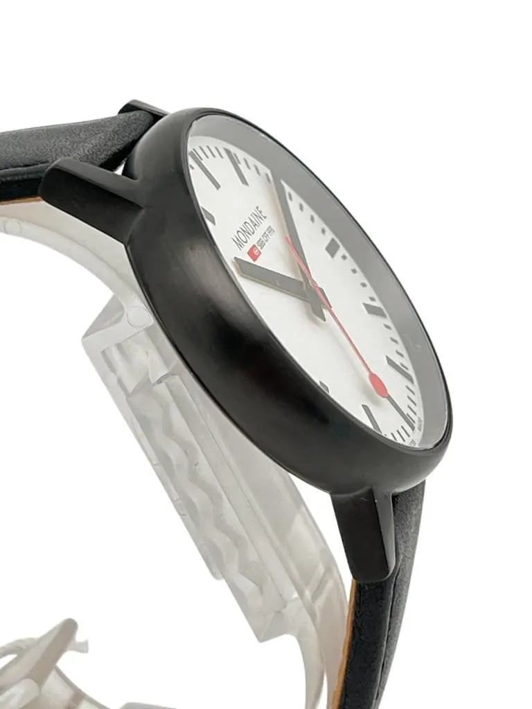 An image of a Wristwatch by Mondaine. This New With Defects item is designed for Men, featuring a Classic,Dress/Formal style. It has a Quartz movement and an Analog display with a White dial color. The indices include 12-Hour Dial,Non-Numeric Hour Marks,Stick Indexes. The band is made of Leather and the case is made of Stainless Steel. The watch has a Round shape with a case size of 40 mm and a case thickness of 10 mm.