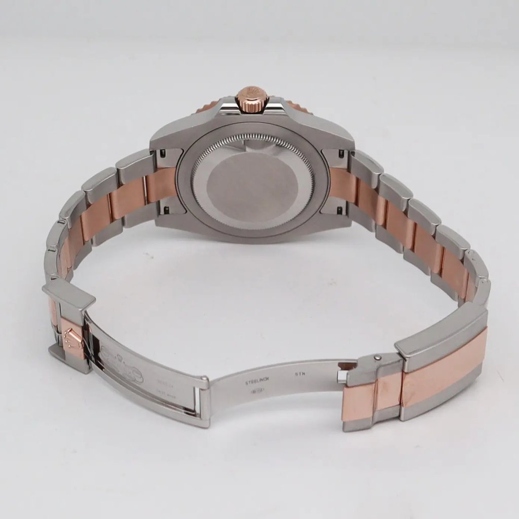 Back View Of Solid Back Case And Open Stainless Steel,Rose Gold Band Of Rolex 126711CHNR Watch Pre Owned Condition