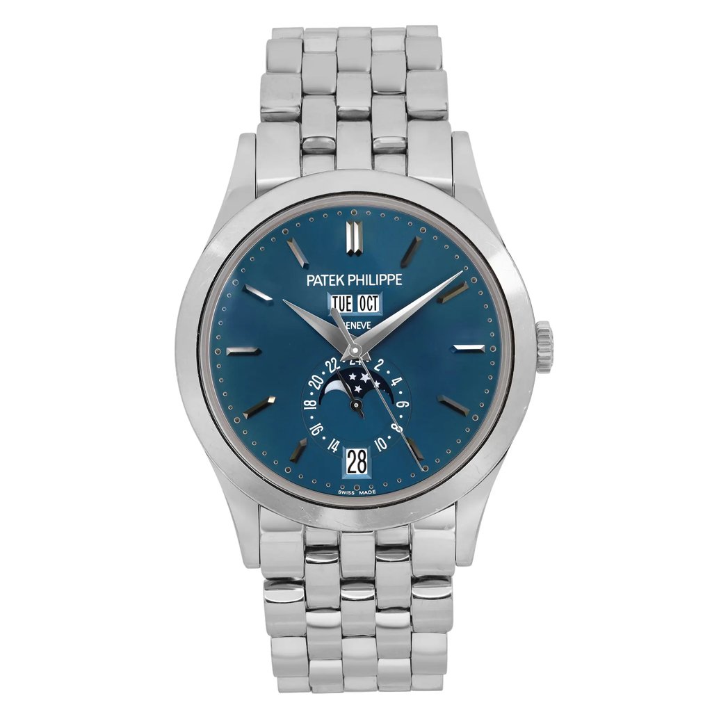 An image of a pre-owned men's Patek Philippe Day-Date Annual Calendar White Gold Blue Dial Watch 5396/1G-001 positioned upright at a straight-on angle. The watch features a white gold bracelet and a blue dial with a date indicator and moon phase complication. The brand name is visible beneath the 12 o'clock position. The watch is centered in the frame, showcasing its design and features clearly.