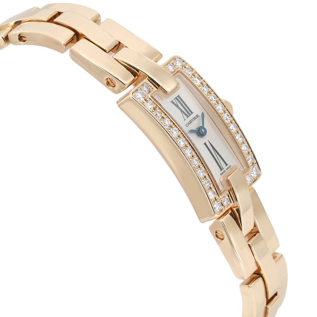 An image of a pre-owned wristwatch shown from a side profile view, opposite the crown. The watch features a rectangular face with Roman numerals and a diamond-studded bezel. The gold link bracelet is partially visible and angled upward, highlighting its polished finish. The image captures the watch from a close distance, emphasizing its elegant design and luxurious details.