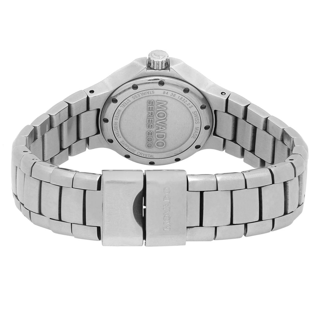 An image of a pre-owned wristwatch captured from the back view, showcasing the closed clasp. The angle is straight-on and at a close distance, highlighting the stainless steel bracelet and engraved details on the case back. The brand name is visible on both the clasp and the case back.