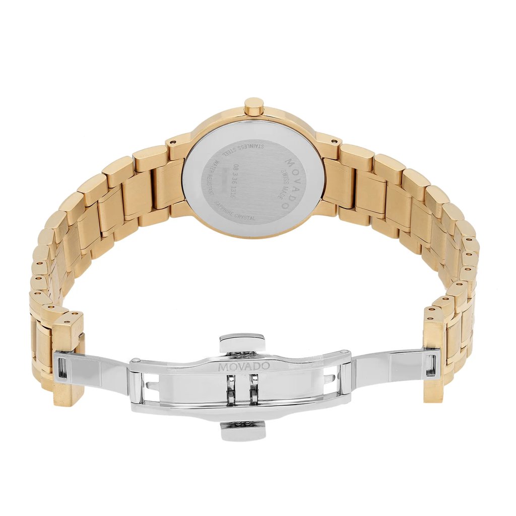 An image of a wristwatch taken from the back view, showcasing an open clasp. The watch is unworn and features a gold-toned bracelet with a stainless steel back. The angle is slightly elevated, capturing the entire band and clasp mechanism. The distance is close enough to highlight the details of the clasp and the engraved brand name.