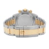 An image of a pre-owned men's Rolex wristwatch captured from the back view. The focus is on the closed fold-over clasp with flip lock safety, showcasing the stainless steel and yellow gold band. The solid caseback is visible, emphasizing the round watch shape. The photograph is taken at a close distance, highlighting the details of the clasp and the dual-tone metal band.