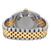 An image of a pre-owned men's Rolex wristwatch, shown from the back view. The photograph captures the solid stainless steel caseback and the dual-tone metal bracelet with a jewelry clasp, featuring both silver and gold links. The angle highlights the closed clasp, emphasizing the round watch shape and showcasing the watch's condition, classified as good.