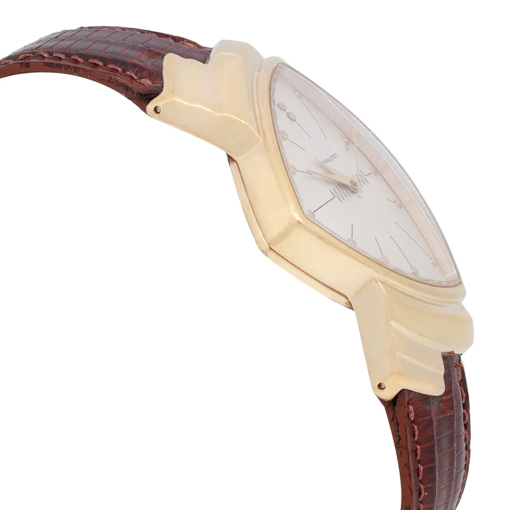 An image of a Wristwatch by Hamilton. This Pre Owned item is designed for Unisex Adult, featuring a Dress/Formal style. It has a Quartz movement and an Analog display with a Silver dial color. The indices include 12-Hour Dial,Stick Indexes. The band is made of Leather and the case is made of Stainless Steel. The watch has a Triangle shape with a case size of 32 mm and a case thickness of 10 mm.
