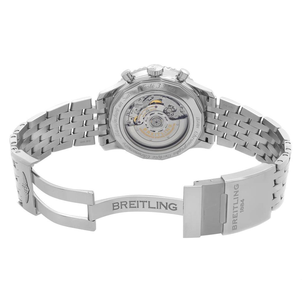 An image of a Breitling men's wristwatch, display model, showcasing the back view with an open clasp. The watch features a stainless steel case with an exhibition caseback, revealing intricate mechanical details. It has a round shape and a stainless steel band, connected by a fold-over clasp engraved with the Breitling logo. The photograph is taken from a rear perspective, with the watch positioned centrally and the clasp extended to the right, creating a clear view of the design and construction. The image is in high resolution and the watch is shown at a close distance, ensuring fine details are visible. The watch is a display model and may show minor blemishes due to store handling.