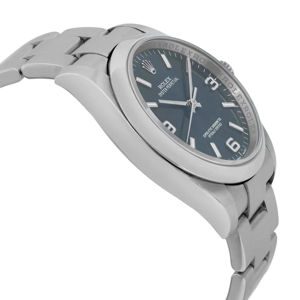 An image of a pre-owned wristwatch viewed from the side profile, opposite the crown. The watch features a metallic bracelet and a visible round face with hour markers. The angle showcases the thickness of the case and the curvature of the bracelet links, taken from a close distance.