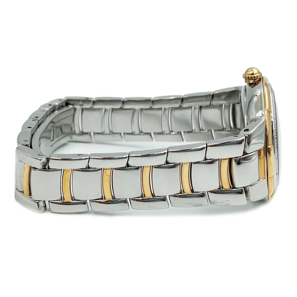 An image of a pre-owned Bulova women's wristwatch in a side profile view focused on the crown. The watch has a round shape with a white dial featuring a diamond pattern, encased in a rose gold-tone bezel. The band is made of stainless steel with rose gold-tone accents, and the crown is visible at the side, indicating the angle of the photograph. The image is taken from a close distance, highlighting the watch's side details and craftsmanship.