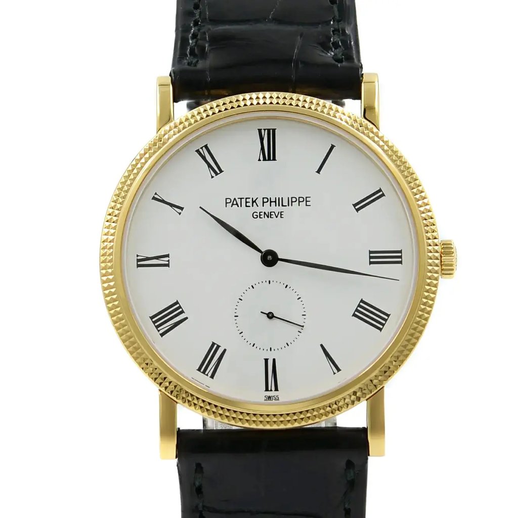 An image of a pre-owned wristwatch taken from a front close-up angle, focusing on the watch face. The watch features a gold bezel with Roman numerals on a white dial. The brand name is visible at the top center, and there is a small subdial near the bottom. The black leather strap is partially visible.