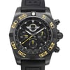 An image of a pre-owned Breitling men's pilot/aviator wristwatch with a close-up frontal view of the round black dial and bezel. The watch features a rubber band, black brushed stainless steel case, and displays 12-hour dial indices with arrow markers and a second hand. The black bezel has yellow numerals and the black dial includes the Breitling logo jet team edition. There are micro insignificant dings on the bezel and case back, with tiny scratches on the case that are barely visible. The shot is taken from a direct, centered angle and fills the frame, showcasing the watch's excellent condition.
