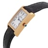An image of a pre-owned wristwatch viewed from the side profile angle, focusing on the crown. The watch has a rectangular gold case and a black leather strap. The face displays Roman numerals and the brand name. The crown is prominently visible, featuring a blue accent. The angle highlights the watch's sleek design and details.
