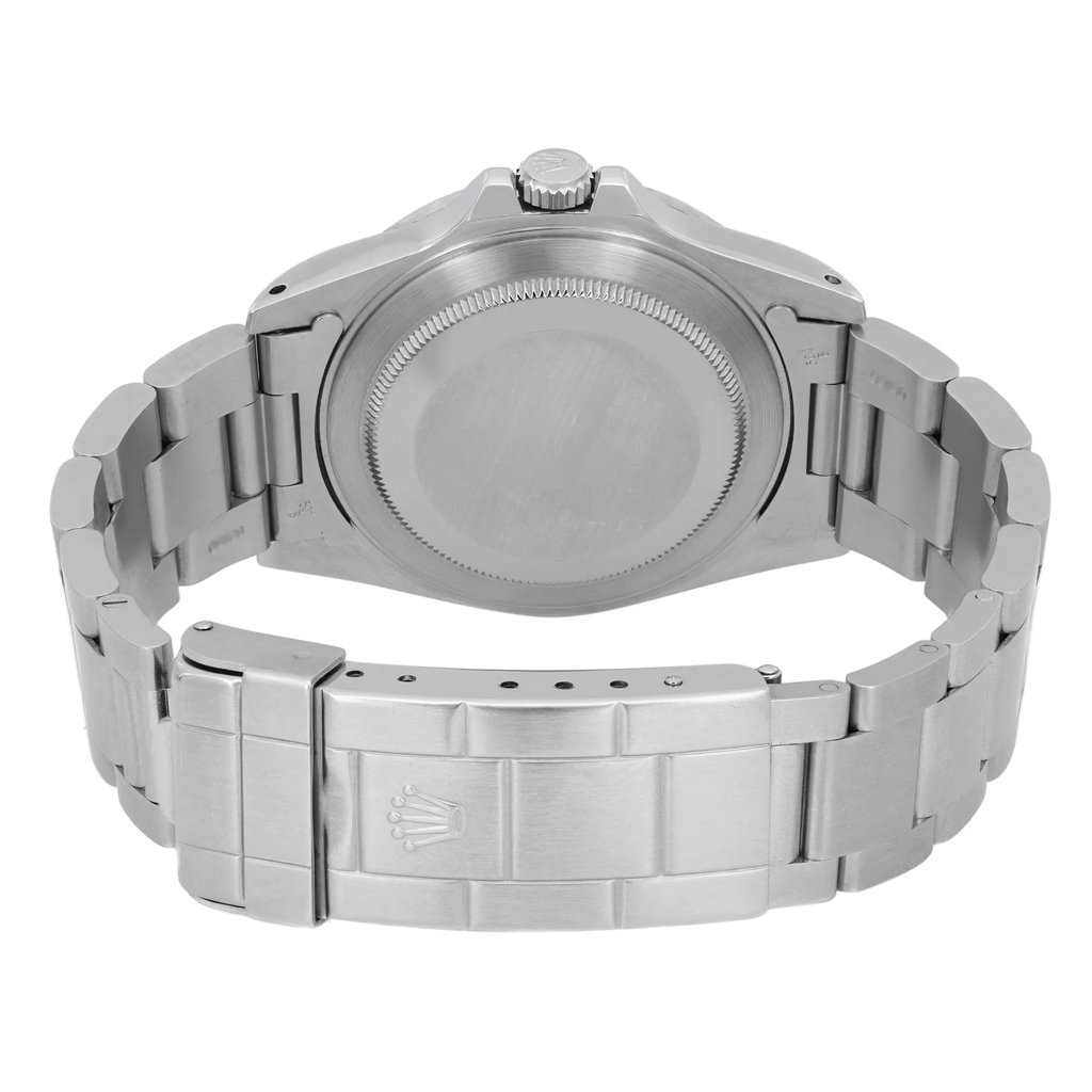 An image of a pre-owned wristwatch taken from the back view, showcasing the clasp in a closed position. The photo is captured from a close distance, highlighting the metal bracelet and the back of the watch case. The angle provides a clear view of the bracelet's links and the distinctive clasp design.