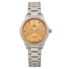 An image of an unworn wristwatch taken from a front full frontal view. The watch features a two-tone metal bracelet with both silver and gold links. The dial is a warm gold color, displaying the brand name and a date window on the right. The watch is positioned centrally with the face clearly visible, showcasing its sleek and elegant design.