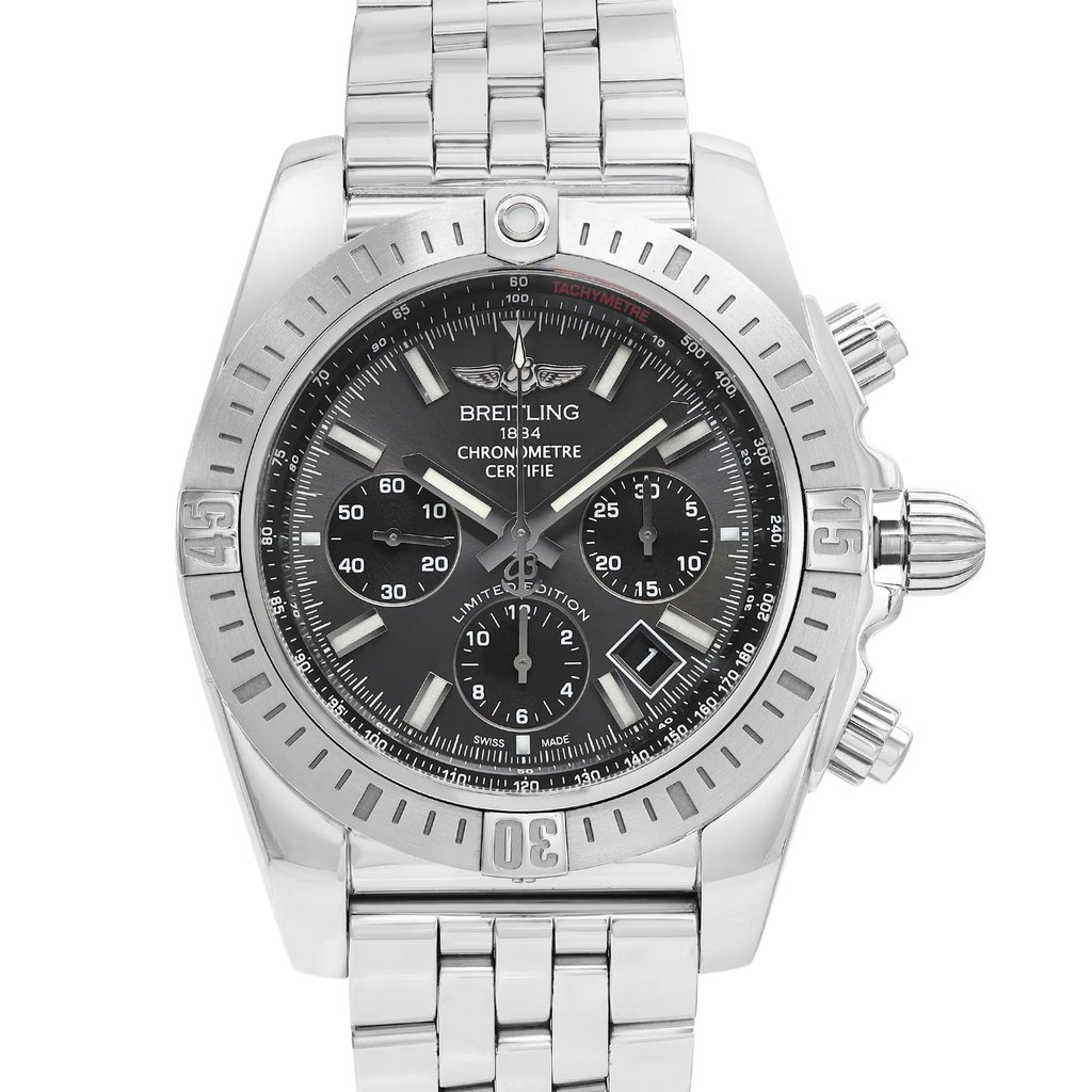 An image of a pre-owned luxury men's Breitling wristwatch in a front close-up view showcasing the watch's face at a direct angle. The watch has a round shape with a gray sunburst dial featuring stick indexes, a 12-hour dial, and three sub dials. The bezel is steel, and the band is made of stainless steel. The watch has a prominent Breitling logo below the 12 o'clock position and three side buttons on the right side of the case. The image is taken from a close distance, providing clear visibility of the watch details. The watch is pre-owned and may have minor scratches and signs of wear.