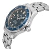 An image of a pre-owned wristwatch viewed from the side profile, showcasing the crown prominently. The watch features a silver metal bracelet and a blue bezel with white markings. The angle captures the watch face slightly tilted, highlighting the hands and indices against the dark dial. The image is taken at a close distance, offering a detailed view of the watch's design and craftsmanship.