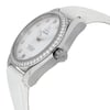 An image of a women's OMEGA wristwatch, shown at a slight angle from the right side. The watch features a round face with a mother of pearl factory dial, adorned with diamond hour markers. Its factory bezel is encrusted with additional diamonds, adding to its elegance. The watch has luminous hands and a date indicator at the 6 o'clock position. The crown, engraved with the OMEGA logo, is visible on the side. A white leather strap is attached to the watch case, and the image is taken from a moderate distance to capture these details clearly.