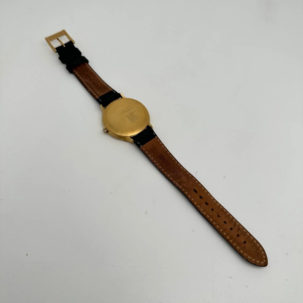 An image of a Wristwatch by Mondaine. This Pre Owned item is designed for Men, featuring a Casual,Classic,Dress/Formal style. It has a Quartz movement and an Analog display with a White dial color. The indices include 12-Hour Dial,Non-Numeric Hour Marks,Stick Indexes. The band is made of Leather and the case is made of Stainless Steel. The watch has a Round shape with a case size of 38 mm and a case thickness of 7 mm.