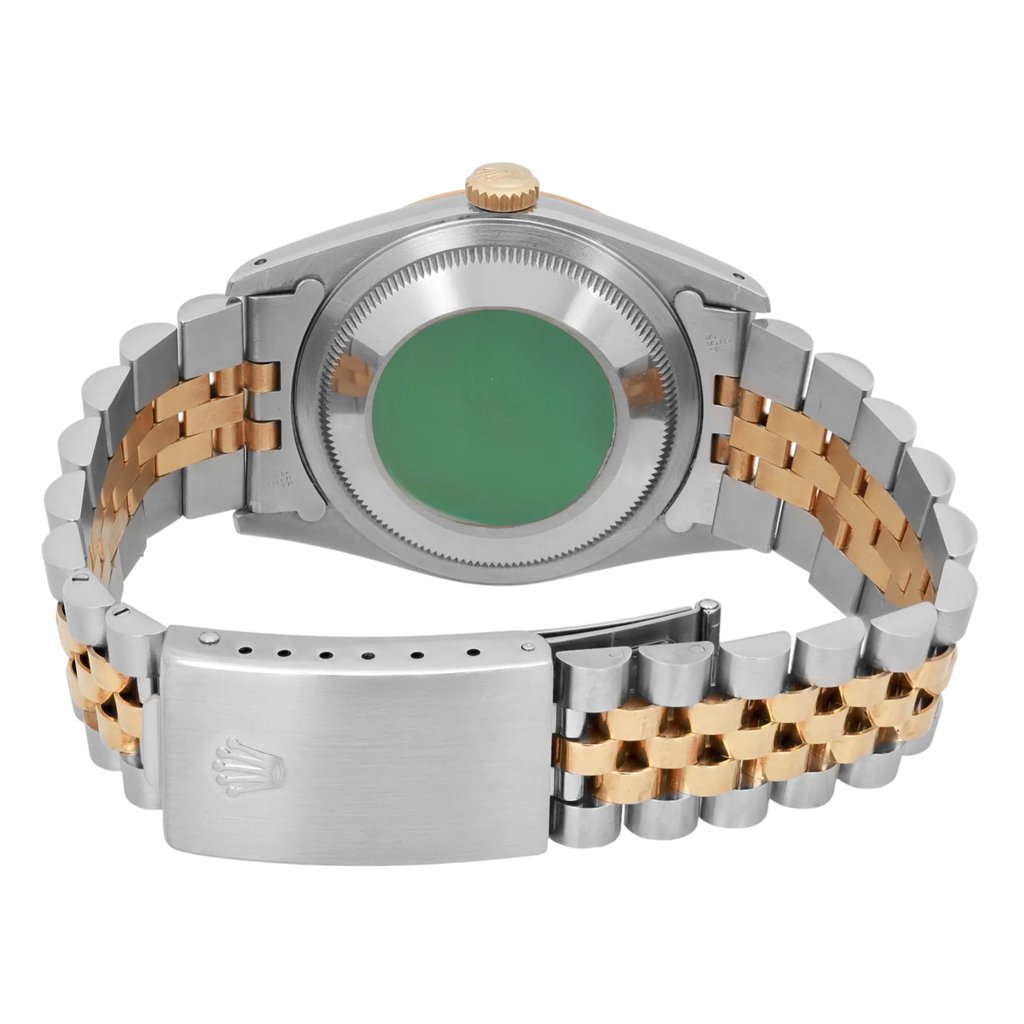 An image of a pre-owned men's Rolex wristwatch viewed from the back. The angle captures the stainless steel and gold-tone bracelet prominently, with the watch face down. The green sticker on the back case is visible, as well as the Rolex logo on the clasp. The photograph is taken at a close distance, highlighting the condition and details of the watch.