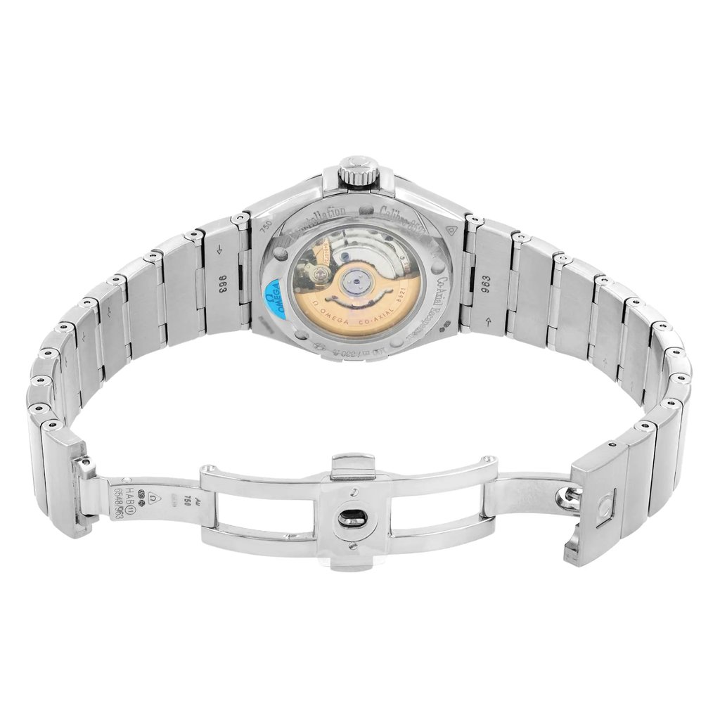 An image of a women's OMEGA wristwatch displayed as a model. The watch is positioned with its back facing the camera, showcasing the intricate mechanical movement through the transparent case back. The bracelet is fully extended, with the clasp open, allowing a clear view of the watch's underside. The angle is slightly elevated, providing a comprehensive look at the watch's design and craftsmanship, captured from a close distance.