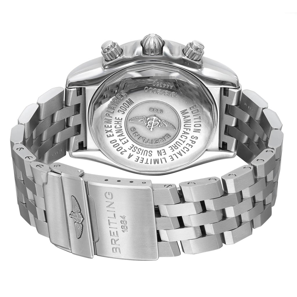 An image of a pre-owned Breitling men's wristwatch in a back view orientation. The watch is presented at a slight angle, showcasing the solid caseback made of stainless steel with engraved brand details. The round watch shape is visible and the stainless steel band leads to a fold-over clasp with flip lock safety, partially open, in the foreground. The perspective is a close-up, emphasizing the watch's closure mechanism and the quality of the materials.