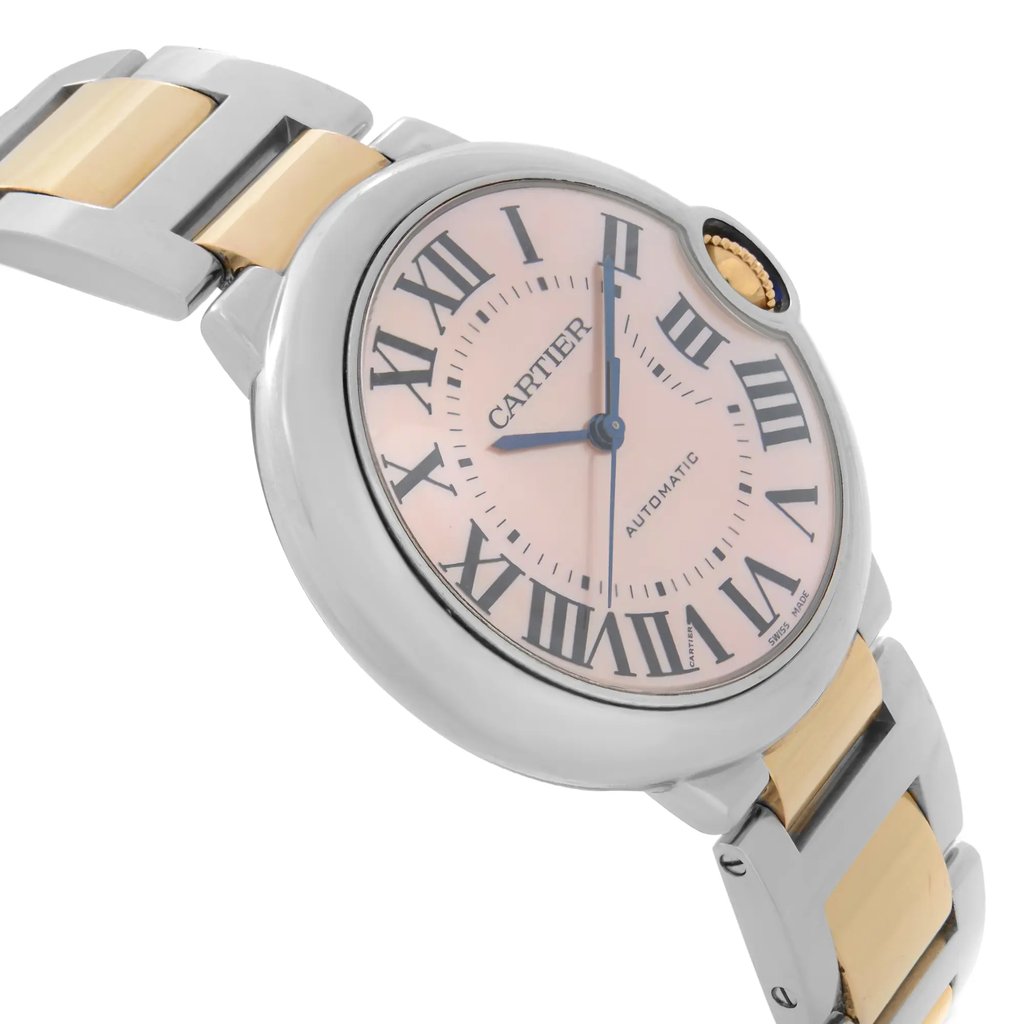 An image of a pre-owned wristwatch captured from a side profile view opposite the crown. The watch features a two-tone metal bracelet with alternating silver and gold links. The dial is adorned with Roman numerals and blue hands, enclosed in a round case. The angle highlights the curvature of the watch face and the sleek design of the bracelet, captured at a close distance.