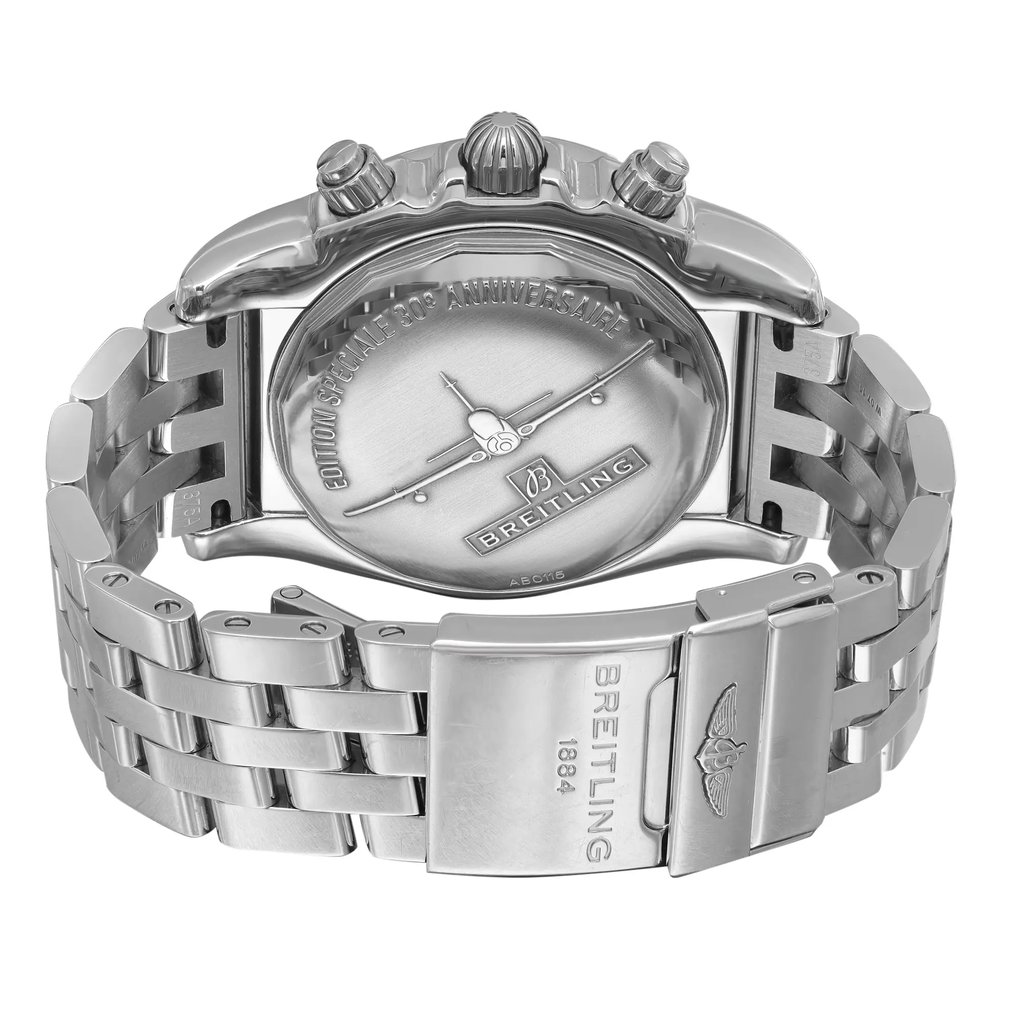 An image of a pre-owned Breitling men's wristwatch with a screwback caseback and a round stainless steel case. The watch is shown from the back, with the fold-over clasp with flip lock safety closed and positioned in the center. The watch is viewed at a slight angle, highlighting the clasp and the links of the stainless steel band. The distance is close enough to reveal the texture and engravings on the clasp and the overall condition of the watch. The watch has minor dings on the lugs and minor nicks on the back case.