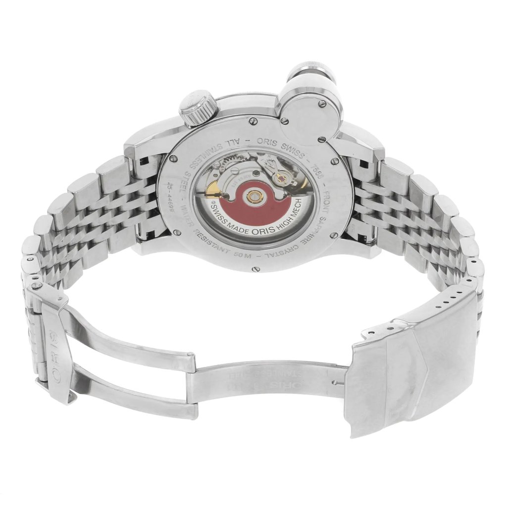 An image of a pre-owned wristwatch showing the back view with an open clasp. The watch is positioned at a slight angle, highlighting its stainless steel bracelet and the intricate details of its exposed movement. The clasp is partially extended, providing a clear view of the inner mechanisms. The photograph is taken from a close distance, focusing on the craftsmanship and design of the watch.
