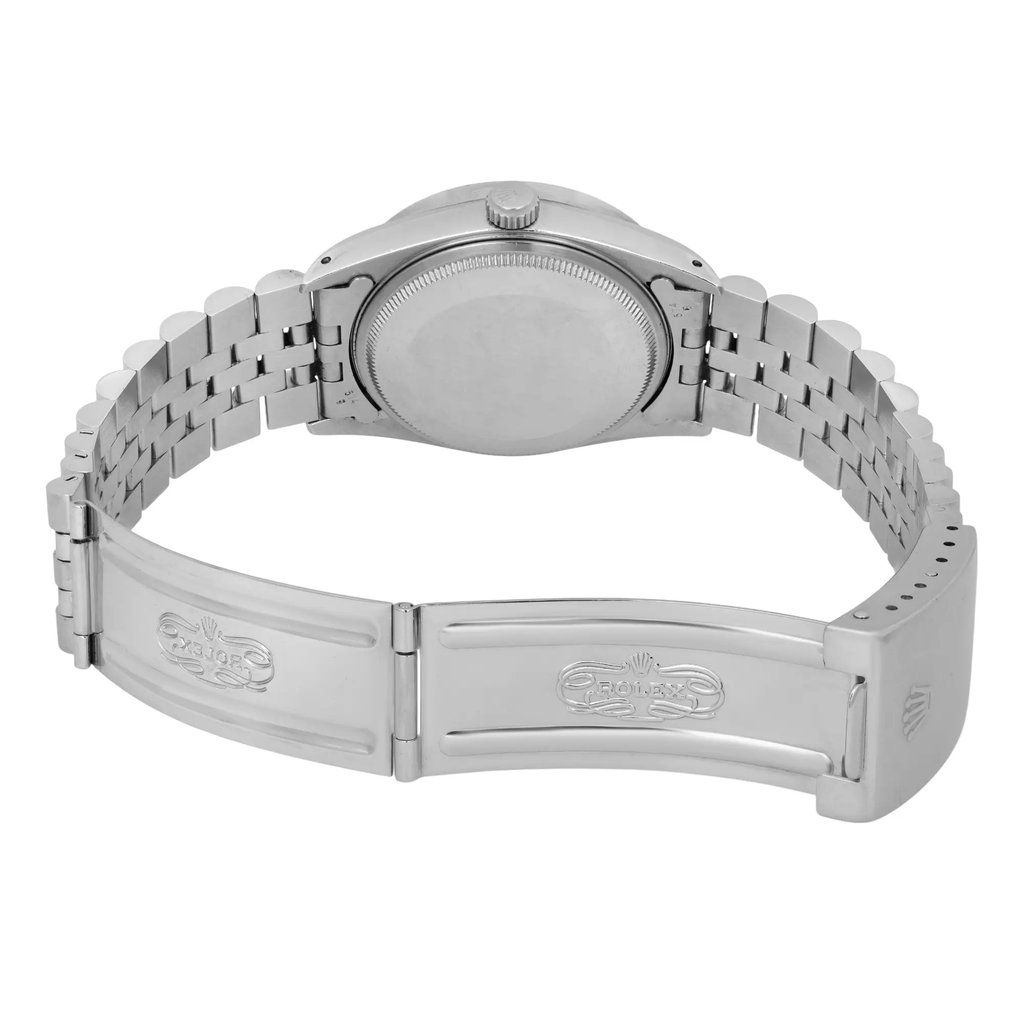 An image of a pre-owned Rolex wristwatch taken from a rear angle, showcasing the closed stainless steel bracelet and clasp. The watch is positioned upright, with the back of the case and the folded clasp prominently displayed. The angle highlights the bracelet links and the engraved Rolex logo on the clasp. The photograph is taken from a close distance, focusing on the watch’s details.