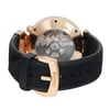 An image of a pre-owned wristwatch shown from the back view, highlighting the intricate mechanical components through a transparent case back. The watch is positioned at a slight angle, allowing a clear view of the close clasp which is prominently displayed in the foreground. The gold-tone elements contrast with the black textured strap, creating an elegant appearance. The photo is taken from a close distance, emphasizing the craftsmanship and details of the watch.